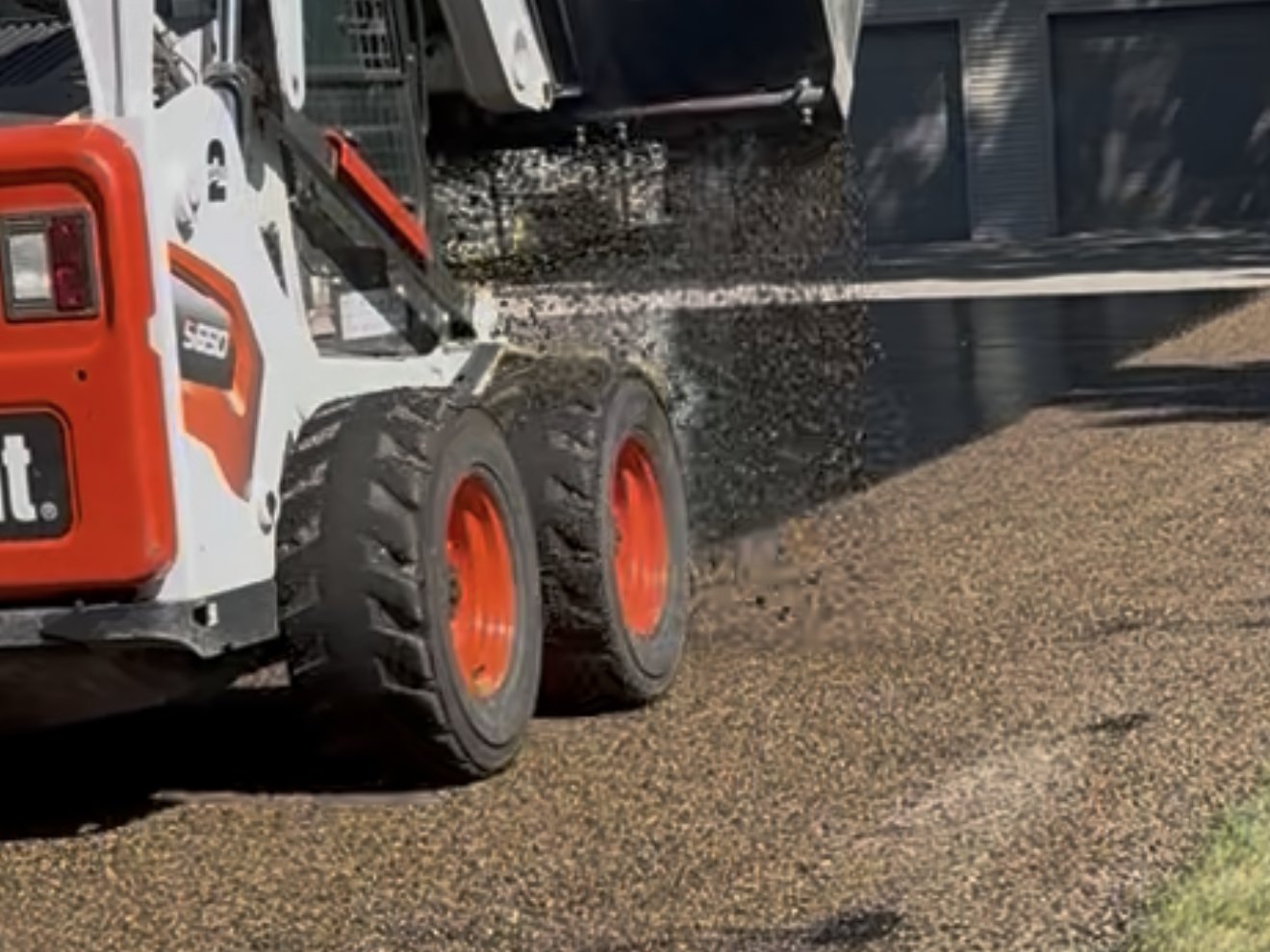 Chip seal being applied to an Arizona driveway